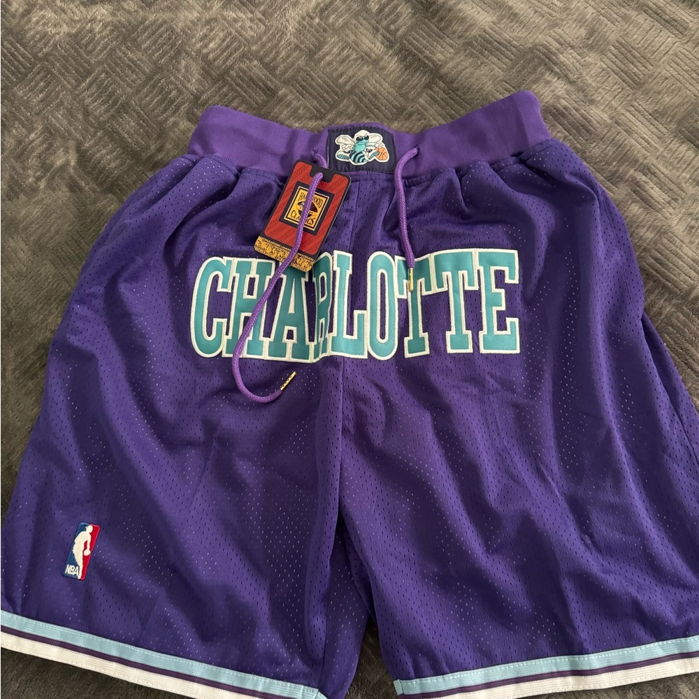 Purple Athletic Basketball Shorts with Charlotte Hornets Design
